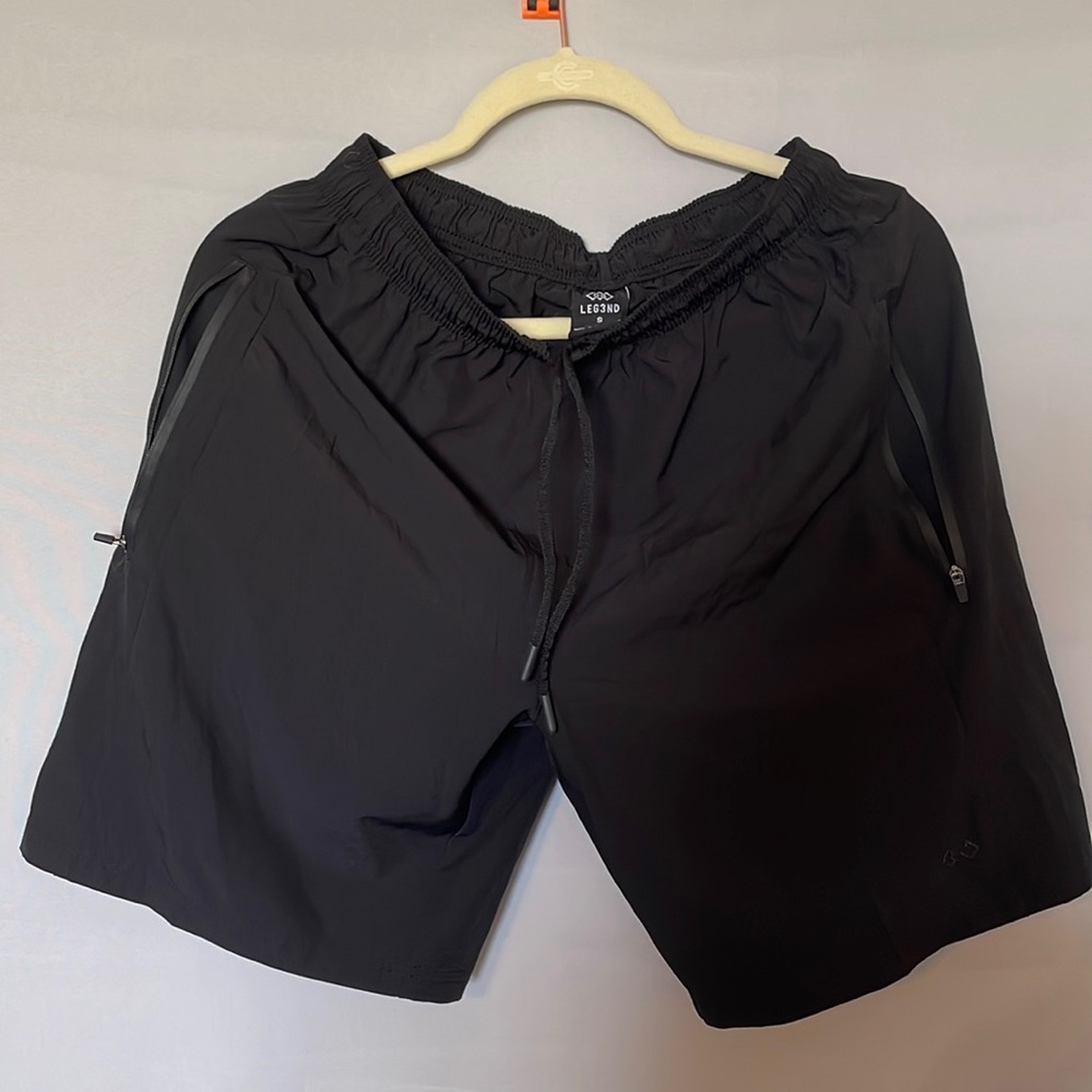 Men’s versatile, black, zip pocket shorts